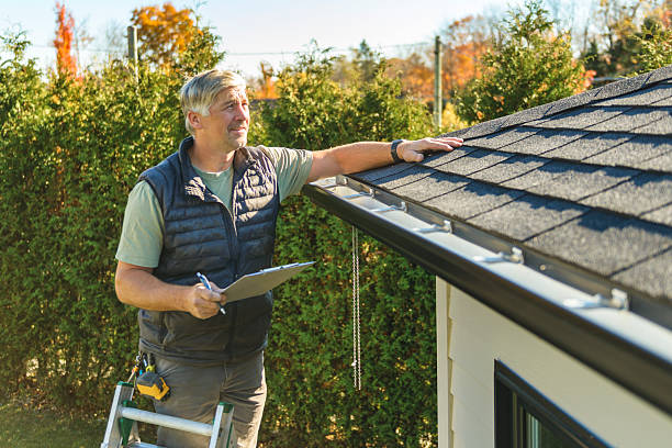 Professional Roofing technician working in Moorland, IA